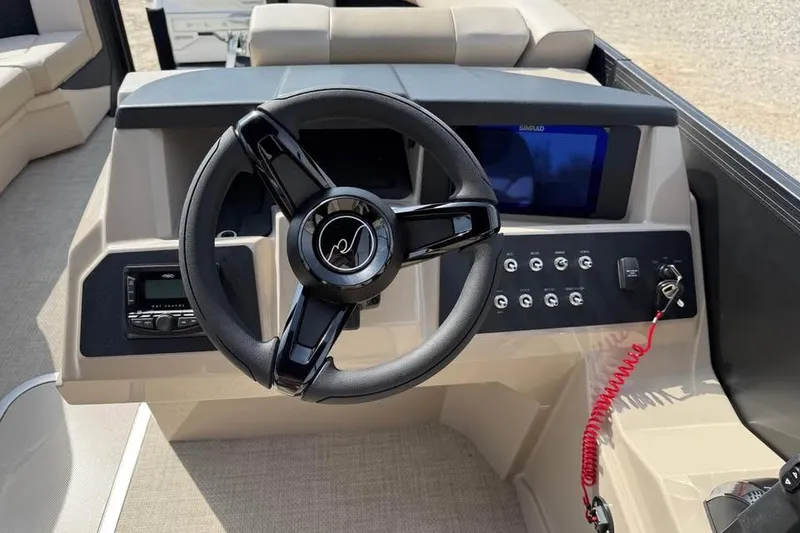 Slide: The Image of Steering console of 2026 Alera 22q boat with modern controls and display. - 13