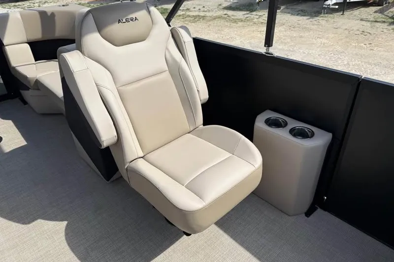 Slide: The Image of Luxurious beige seating in 2026 Alera 22q boat with dual cup holders. - 14