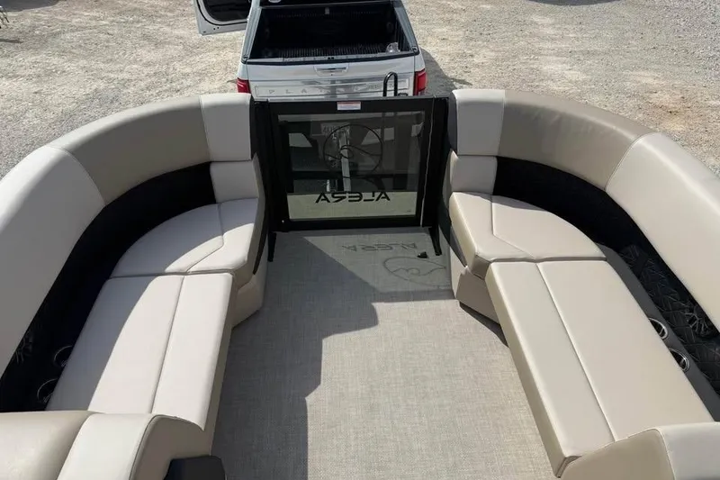 Slide: The Image of 2026 Alera 22q boat interior with beige seating and open rear gate. - 15