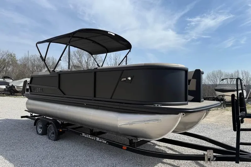 Slide: The Image of 2026 Alera 22q pontoon boat on trailer under clear sky. - 3