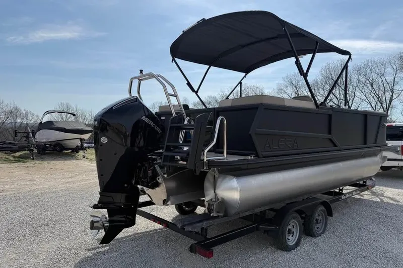 Slide: The Image of 2026 Alera 22q pontoon boat on trailer with Mercury outboard motor. - 7