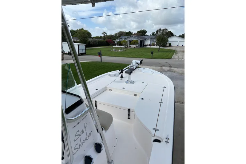 Slide: The Image of 2020 Sea Born FX22 Bay boat parked in a residential driveway. - 14