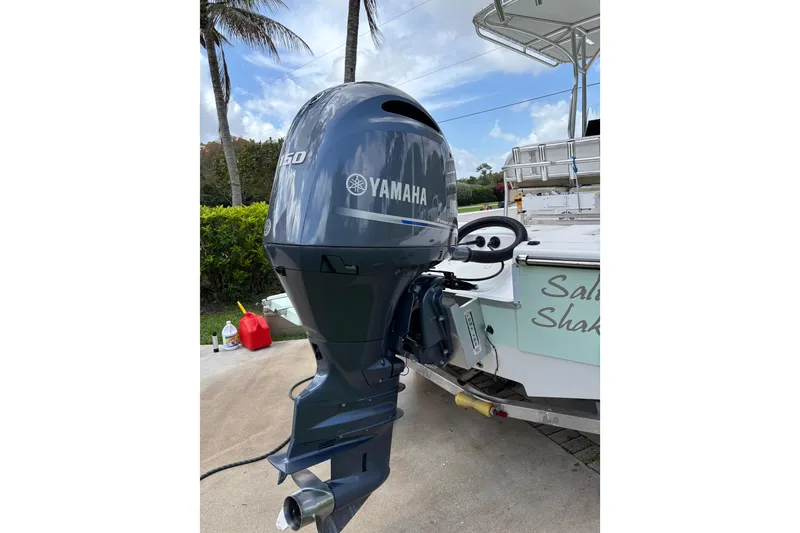 Slide: The Image of 2020 Sea Born FX22 Bay boat with Yamaha outboard motor, docked outdoors. - 28