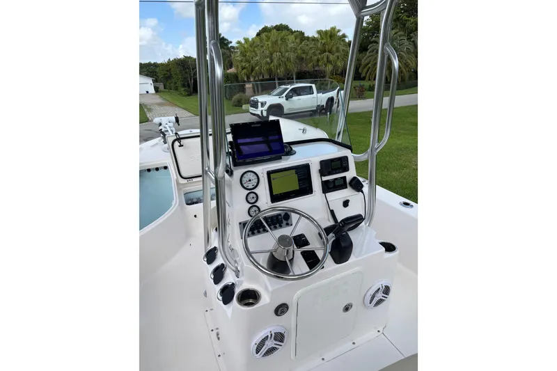 Slide: The Image of 2020 Sea Born FX22 Bay boat console with steering wheel and navigation equipment. - 9