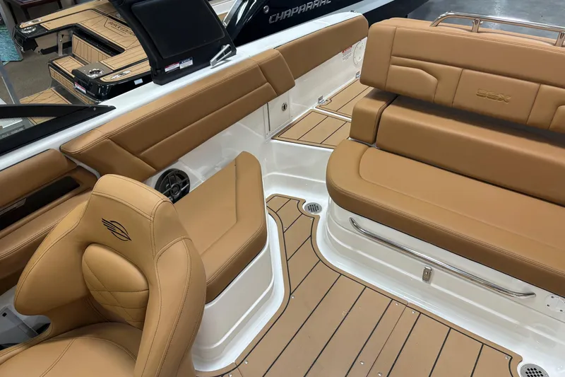 Slide: The Image of 2026 Chaparral SSX 4 boat interior with tan leather seating and sleek design. - 10