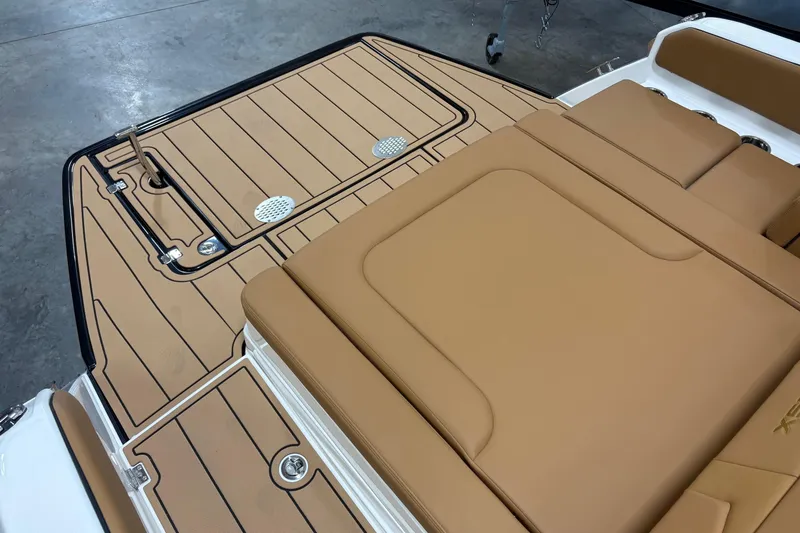 Slide: The Image of 2026 Chaparral SSX 4 boat deck with tan upholstery and sleek design. - 11
