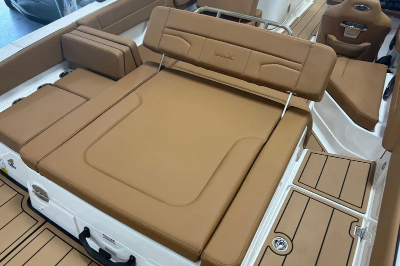 Slide: The Image of 2026 Chaparral SSX 4 boat interior with tan leather seating and sleek design. - 12