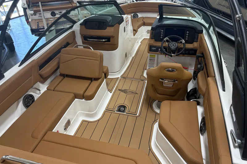 Slide: The Image of Interior of 2026 Chaparral SSX 4 boat with tan seating and modern dashboard. - 3
