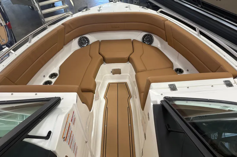 Slide: The Image of 2026 Chaparral SSX 4 boat interior with tan seating and cup holders. - 4