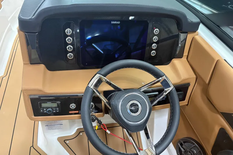 Slide: The Image of 2026 Chaparral SSX 4 boat dashboard with steering wheel and digital display. - 6