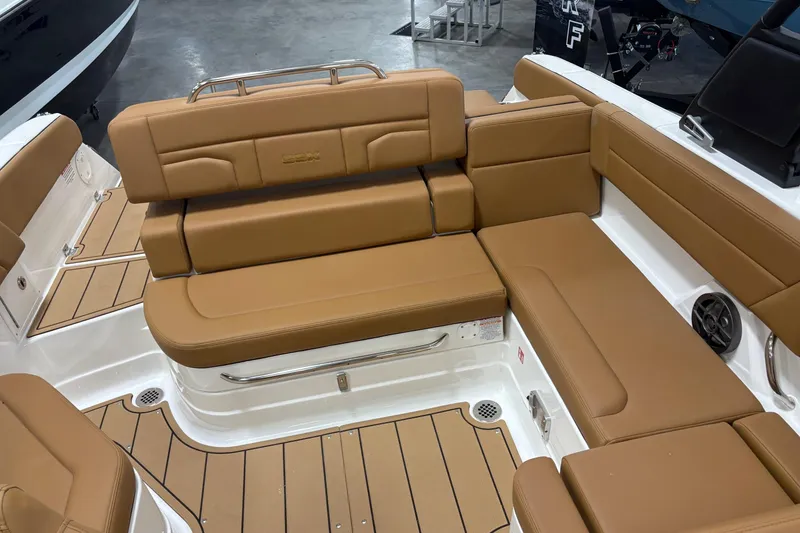 Slide: The Image of Luxurious seating on 2026 Chaparral SSX 4 boat, featuring tan upholstery and sleek design. - 9