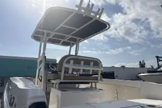 Slide: The Image of 2023 Bayliner Trophy T22CC boat under a sunny sky, showcasing its sleek design. - 8