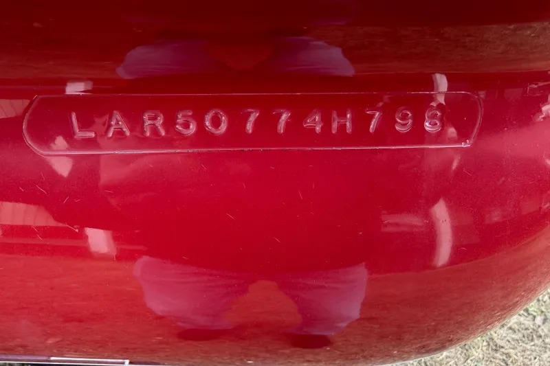 The Image of VIN on red 1998 Larson Escape Delta-Conic boat hull, code LAR50774H798. - 1