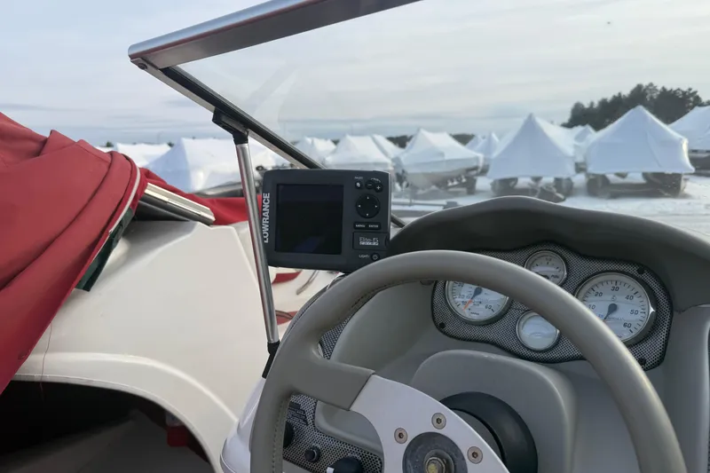 Slide: The Image of Interior view of 1998 Larson Escape Delta-Conic boat with gauges and GPS system. - 11