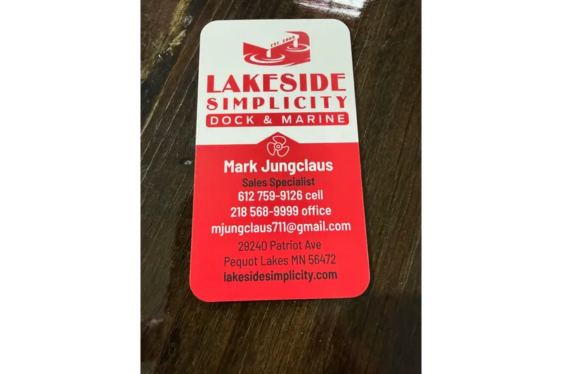 Slide: The Image of Business card for Lakeside Simplicity Dock & Marine, featuring contact details for Mark Jungclaus. - 9