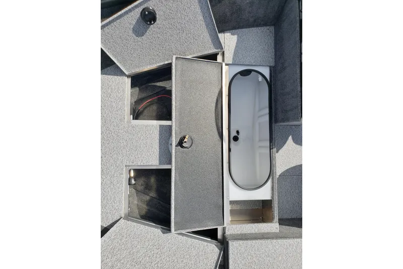 Slide: The Image of 2026 Alumacraft Escape 165 CS boat storage compartments with open hatches and interior view. - 12
