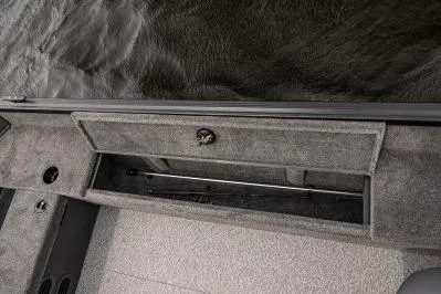 Slide: The Image of 2026 Alumacraft Escape 165 CS boat interior storage compartment by the water. - 5