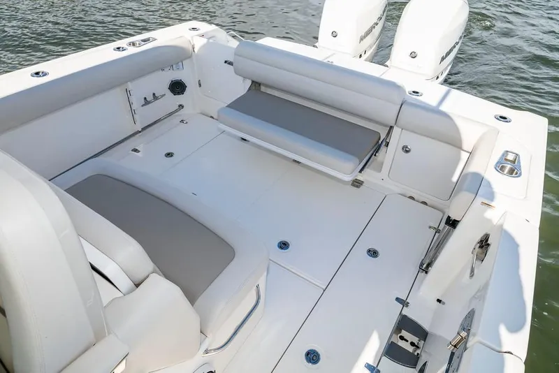 Slide: The Image of Manufacturer Provided Image: 2019 Boston Whaler 330 Outrage boat deck with seating and storage compartments. - 15