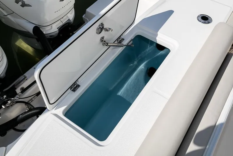 Slide: The Image of Manufacturer Provided Image: 2019 Boston Whaler 330 Outrage livewell compartment with open lid. - 16