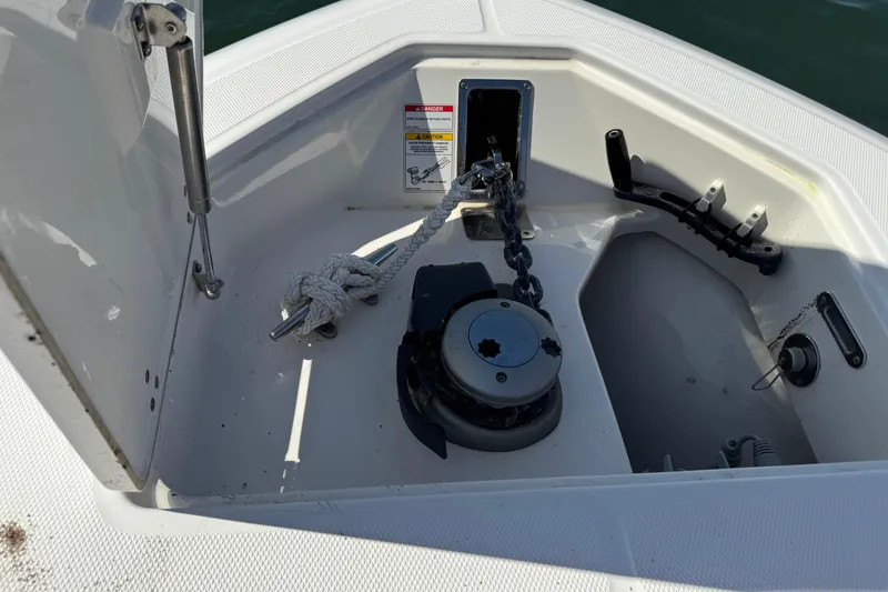 Slide: The Image of Anchor compartment of 2019 Boston Whaler 330 Outrage with chain and rope. - 18