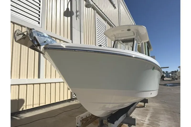 Slide: The Image of 2023 Edgewater 230CC boat displayed outdoors, showcasing sleek design and modern features. - 3