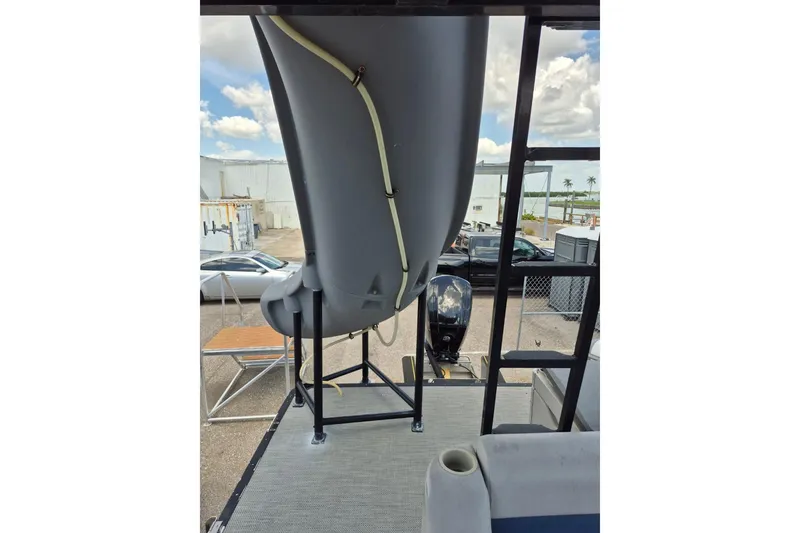 Slide: The Image of 2022 Sport Pontoons Tritoon Slide with water slide and motor, parked outdoors. - 17