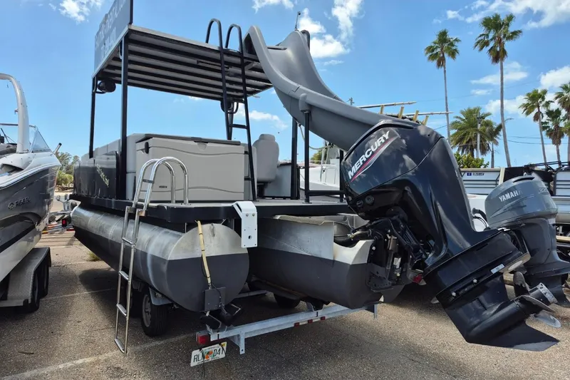 Slide: The Image of 2022 Sport Pontoons Tritoon Slide with Mercury engine, featuring a slide and ladder. - 7