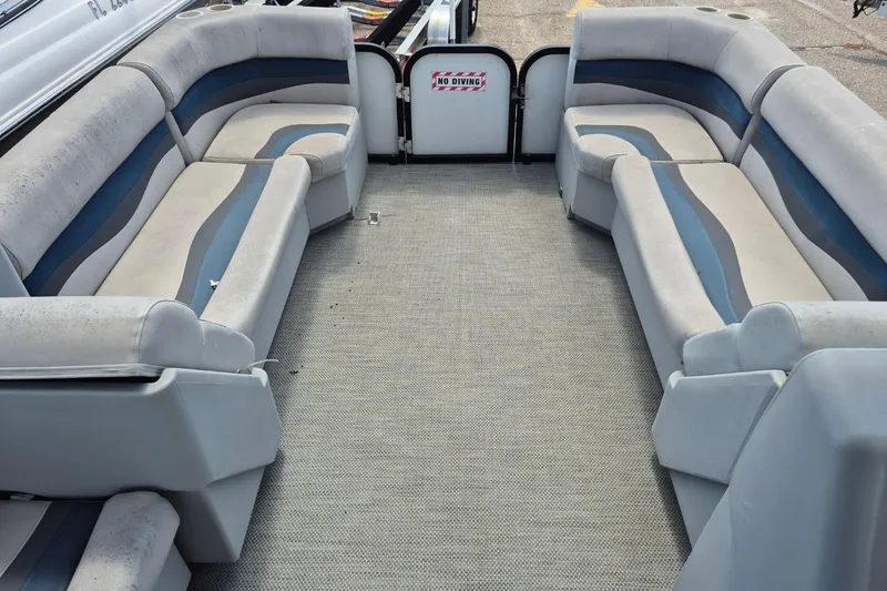 Slide: The Image of 2022 Sport Pontoons Tritoon Slide interior with spacious seating and "No Diving" sign. - 12