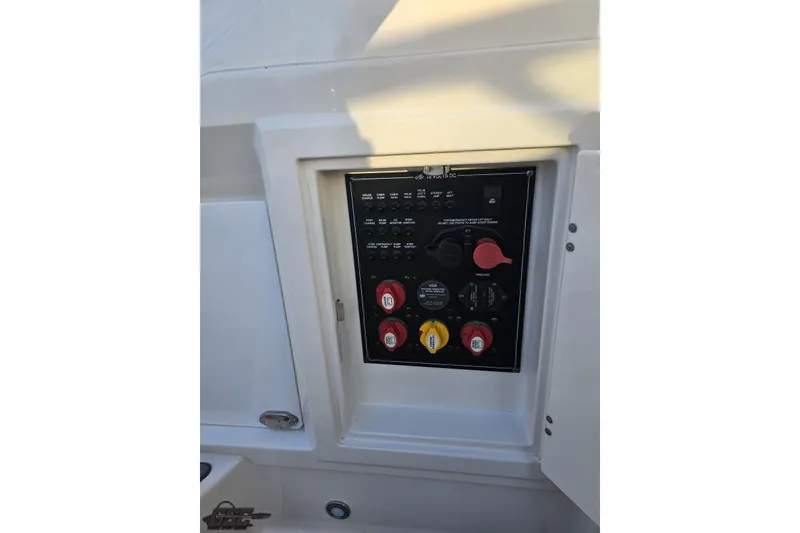 Slide: The Image of Control panel of a 2011 Monterey 328SS Super Sport boat, featuring switches and dials. - 102