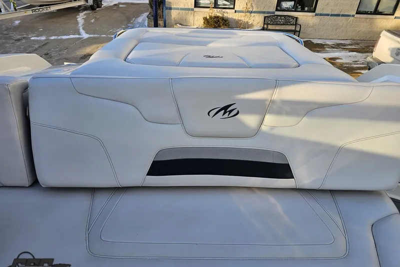 Slide: The Image of 2011 Monterey 328SS Super Sport boat interior with white upholstery and logo. - 105