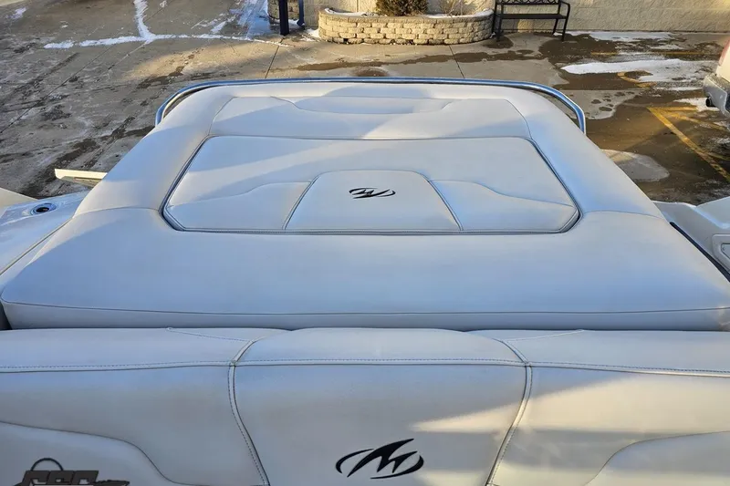 Slide: The Image of Rear view of a 2011 Monterey 328SS Super Sport boat with cushioned seating. - 106