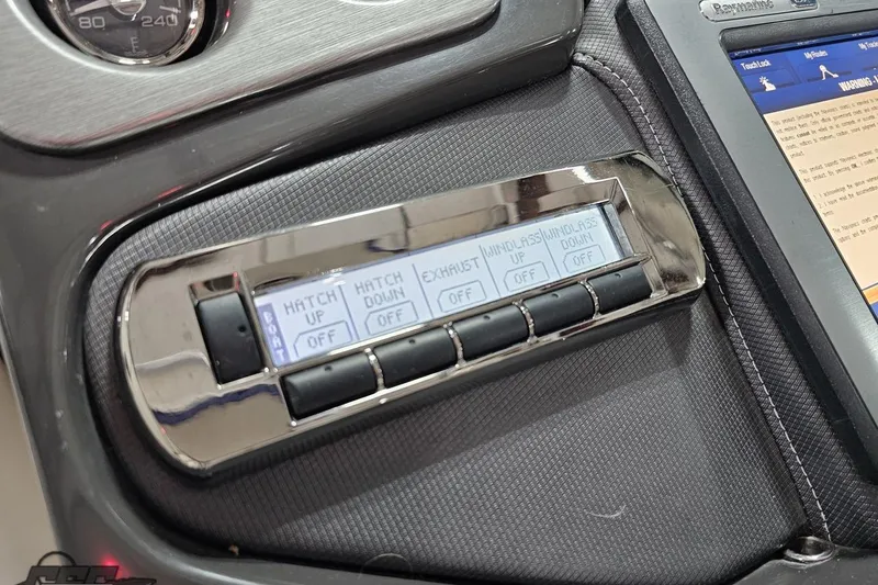 Slide: The Image of Control panel of a 2011 Monterey 328SS Super Sport boat with various function buttons. - 107