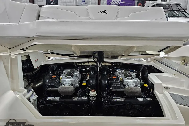 Slide: The Image of Engine compartment of a 2011 Monterey 328SS Super Sport boat, showcasing dual engines. - 108