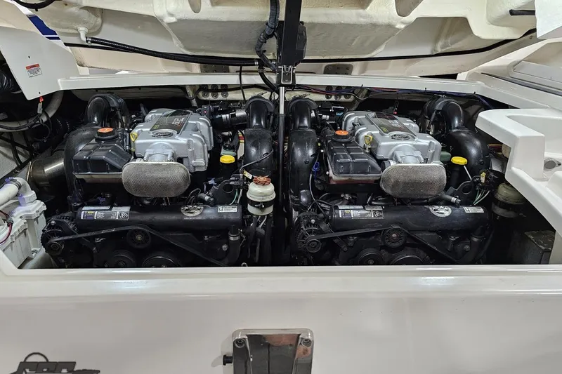 Slide: The Image of Engine compartment of a 2011 Monterey 328SS Super Sport boat, showcasing dual engines. - 109