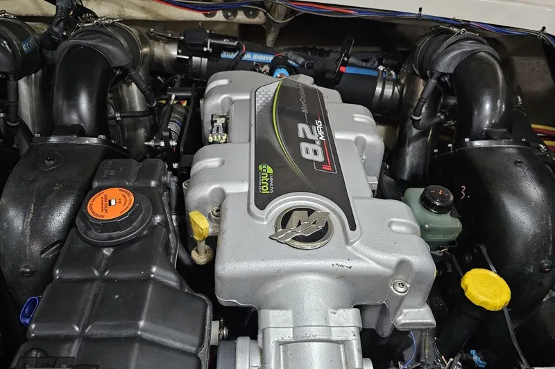 Slide: The Image of Engine of a 2011 Monterey 328SS Super Sport boat, featuring an 8.2 MAG motor. - 111