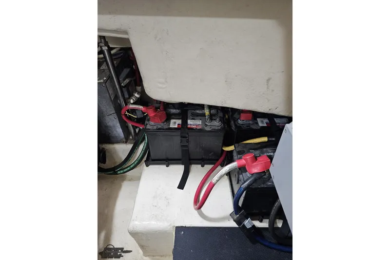 Slide: The Image of Battery compartment of a 2011 Monterey 328SS Super Sport boat with cables and connections. - 112