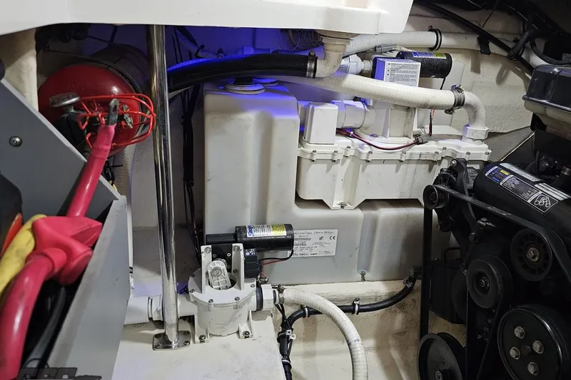 Slide: The Image of Engine compartment of a 2011 Monterey 328SS Super Sport boat, showcasing mechanical components. - 113