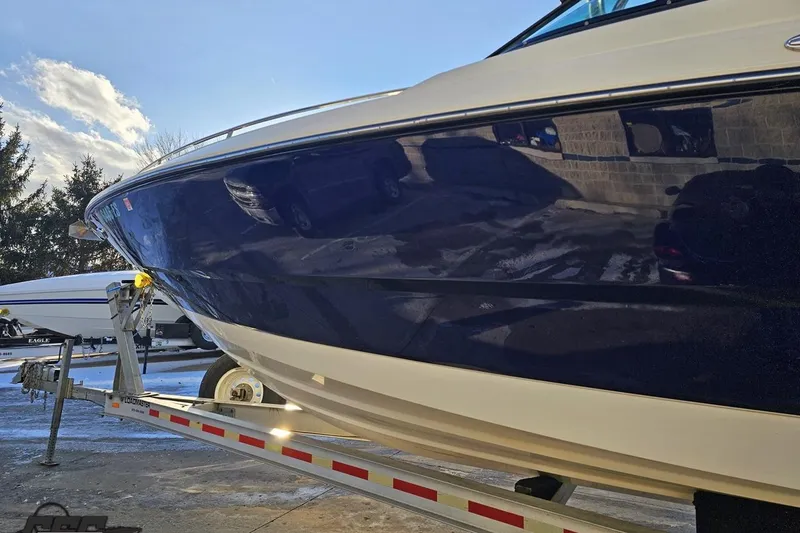 Slide: The Image of 2011 Monterey 328SS Super Sport boat on trailer under clear sky. - 14