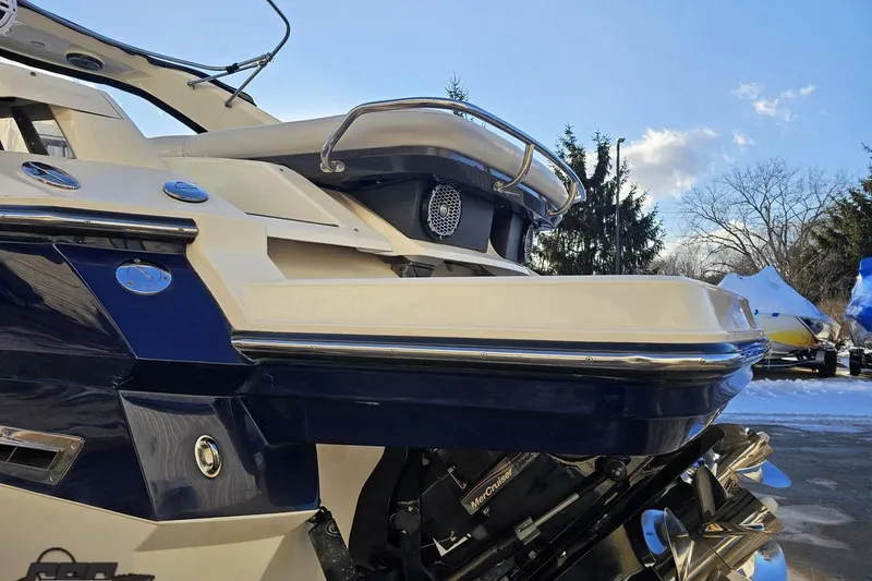 Slide: The Image of 2011 Monterey 328SS Super Sport boat, rear view, showcasing sleek design and powerful engine. - 17