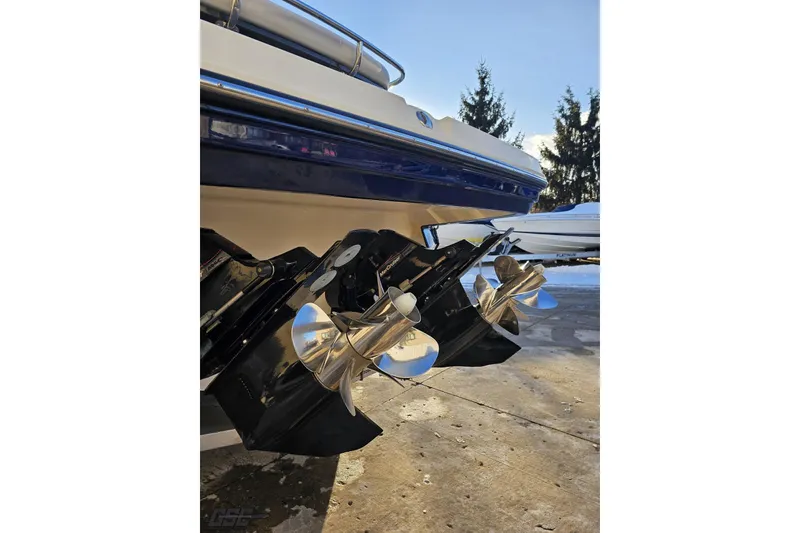 Slide: The Image of 2011 Monterey 328SS Super Sport boat with dual propellers, parked outdoors. - 18