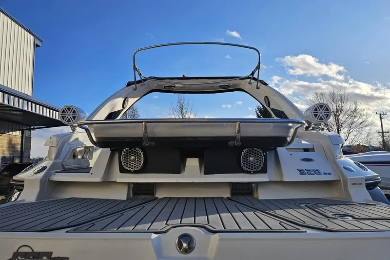 Slide: The Image of 2011 Monterey 328SS Super Sport boat rear view with speakers and clear sky. - 22