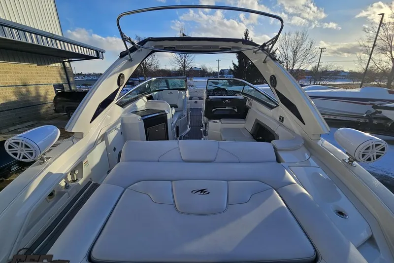 Slide: The Image of 2011 Monterey 328SS Super Sport boat interior with white seating and modern design. - 24