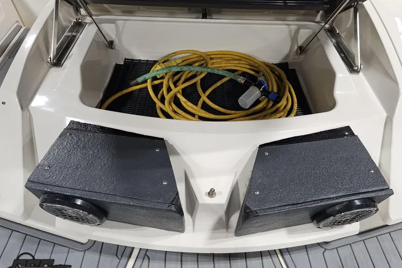 Slide: The Image of Rear view of a 2011 Monterey 328SS Super Sport boat with coiled hose. - 25