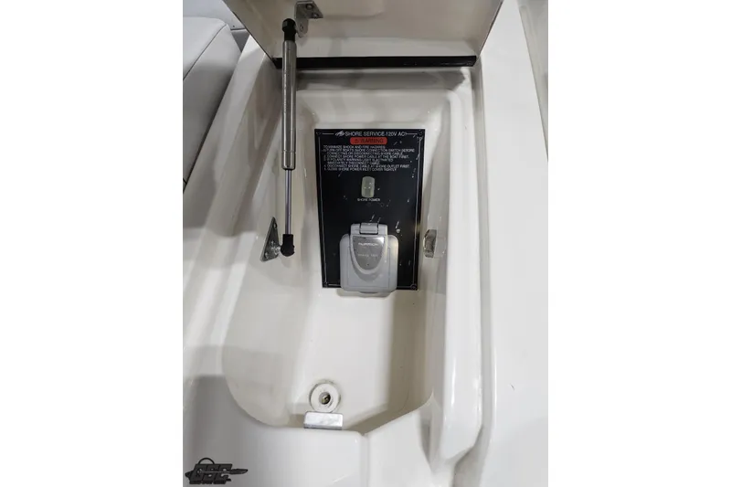 Slide: The Image of 2011 Monterey 328SS Super Sport boat compartment with shore power connection. - 28