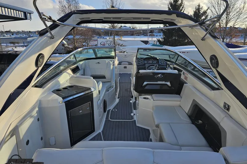 Slide: The Image of Luxurious interior of a 2011 Monterey 328SS Super Sport boat with modern seating and controls. - 29