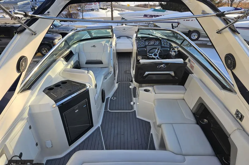 Slide: The Image of Interior of a 2011 Monterey 328SS Super Sport boat with luxurious seating and modern dashboard. - 30