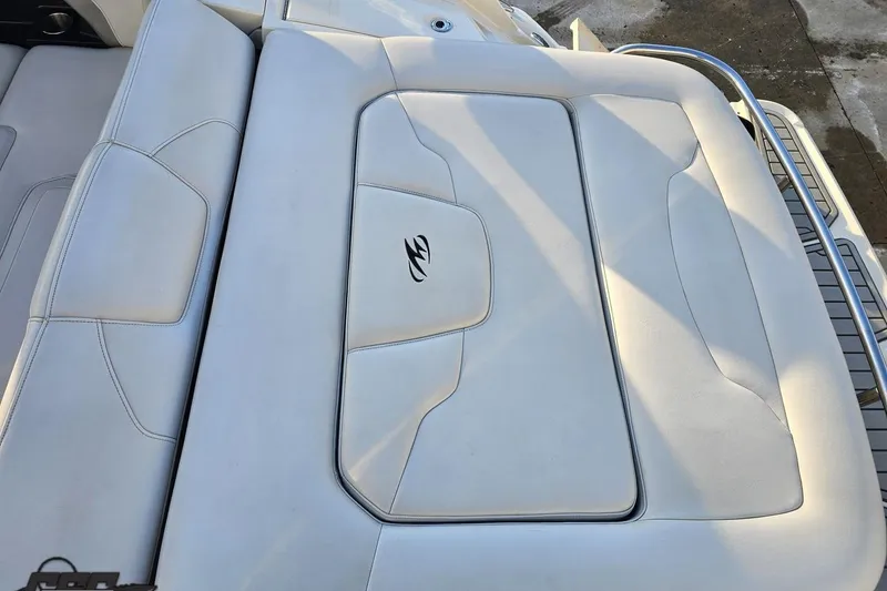 Slide: The Image of 2011 Monterey 328SS Super Sport boat seat with sleek white upholstery and logo. - 34