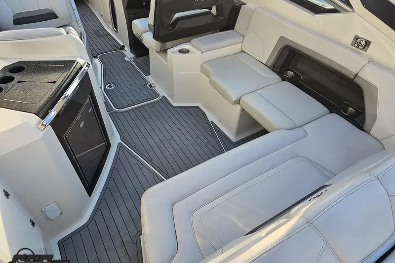 Slide: The Image of Interior of a 2011 Monterey 328SS Super Sport boat with sleek seating and modern amenities. - 35