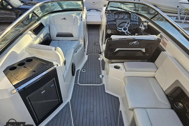 Slide: The Image of Interior of a 2011 Monterey 328SS Super Sport boat with luxurious seating and modern dashboard. - 36