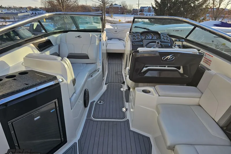 Slide: The Image of Interior of a 2011 Monterey 328SS Super Sport boat with luxurious seating and modern dashboard. - 37
